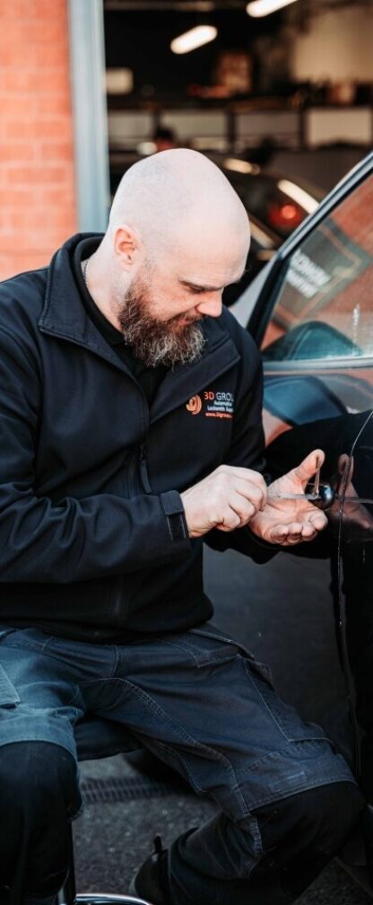 A tech picking a lock