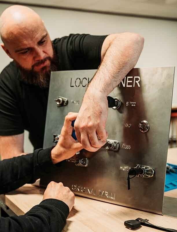 Image of a locksmith using a pickboard.