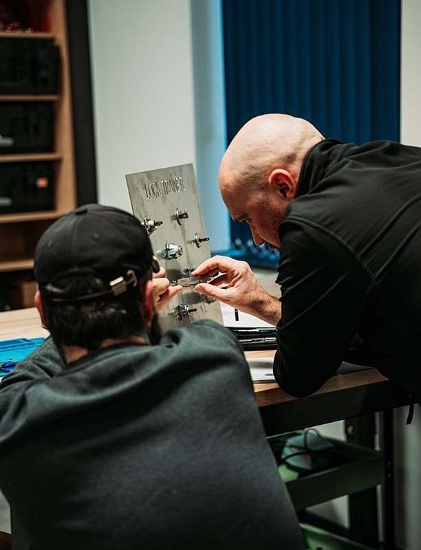 Image of a locksmith using a pickboard.