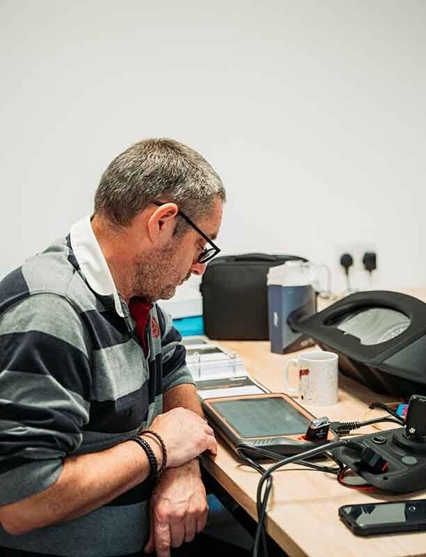 Image of an auto locksmith using a key tool max.