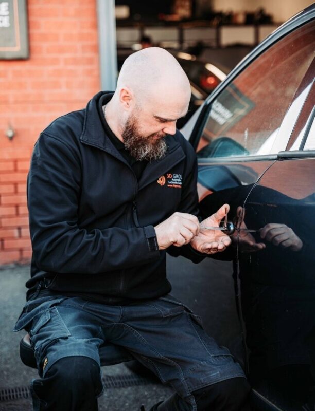 A tech picking a lock